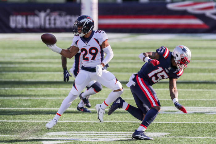 Oct 18, 2020; Foxborough, Massachusetts, USA; Denver Broncos cornerback Bryce Callahan (29) intercepts a pass against the New England Patriots during the second half at Gillette Stadium. Mandatory Credit: Paul Rutherford-USA TODAY Sports